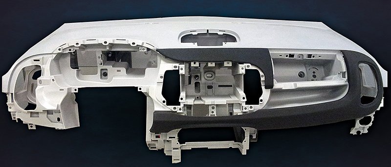 A rack full of aluminum parts undergoing batch anodizing, representing high-volume production
