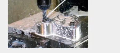 CNC machine cutting a metal part
